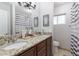 Well-lit bathroom with a granite countertop and a shower/tub at 3419 E Cholla St, Phoenix, AZ 85028