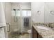 Bathroom featuring a shower, vanity, and light tile at 3419 E Cholla St, Phoenix, AZ 85028