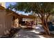 Inviting covered patio featuring an outdoor dining area, perfect for entertaining and relaxation at 3419 E Cholla St, Phoenix, AZ 85028