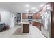 Modern kitchen with granite countertops, stainless steel appliances, and a center island at 3419 E Cholla St, Phoenix, AZ 85028