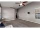 Serene bedroom with gray walls, plush carpet, and a ceiling fan at 3424 E Flamingo Ct, Gilbert, AZ 85297