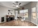 Cozy dining area featuring a rustic cabinet, modern chairs, and plenty of natural light from surrounding windows at 3424 E Flamingo Ct, Gilbert, AZ 85297