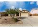 Charming single-story home with a two-car garage and well-maintained desert landscaping at 3424 E Flamingo Ct, Gilbert, AZ 85297