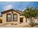 Charming single-story home with a two-car garage and well-maintained desert landscaping at 3424 E Flamingo Ct, Gilbert, AZ 85297