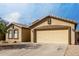 Charming single-story home with a two-car garage and well-maintained desert landscaping at 3424 E Flamingo Ct, Gilbert, AZ 85297