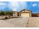 Charming single-story home with a two-car garage and well-maintained desert landscaping at 3424 E Flamingo Ct, Gilbert, AZ 85297