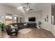 Spacious living room with vaulted ceilings, hardwood floors and large windows for natural light at 3424 E Flamingo Ct, Gilbert, AZ 85297