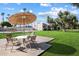 Exterior view of outdoor seating area and lush green lawn at 3737 E Turney Ave # 206, Phoenix, AZ 85018