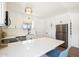 Well-lit kitchen with white cabinets, stainless steel appliances and large quartz countertop island at 3737 E Turney Ave # 206, Phoenix, AZ 85018