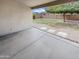 Covered back patio providing an excellent outdoor living space with a view of the well-maintained backyard at 4216 S 100Th Dr, Tolleson, AZ 85353