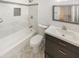 Modern bathroom featuring bathtub and vanity with a dark-colored cabinet at 4216 S 100Th Dr, Tolleson, AZ 85353