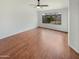 A spacious bedroom featuring a ceiling fan, flooring, and window at 4216 S 100Th Dr, Tolleson, AZ 85353