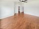 Large main bedroom featuring a ceiling fan, vinyl floors and access to a walk-in closet at 4216 S 100Th Dr, Tolleson, AZ 85353