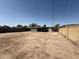 A view of the backyard featuring a block fence and the rear of the house, offering space and privacy at 4221 N 33Rd Dr, Phoenix, AZ 85017