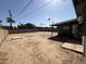 Large, empty backyard space with dirt ground and partial view of neighboring structures at 4221 N 33Rd Dr, Phoenix, AZ 85017