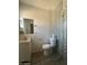 A full bathroom with a sink, toilet, and glass shower at 4221 N 33Rd Dr, Phoenix, AZ 85017