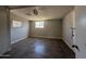 This room features a window, tile floor, a ceiling fan, and fresh, neutral paint at 4221 N 33Rd Dr, Phoenix, AZ 85017