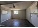 This room features a window, tile floor, a ceiling fan, and fresh, neutral paint at 4221 N 33Rd Dr, Phoenix, AZ 85017