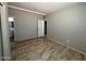 Bedroom with tile floors and views into the bathroom at 4221 N 33Rd Dr, Phoenix, AZ 85017