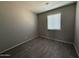 A room with grey walls and wood floors at 4221 N 33Rd Dr, Phoenix, AZ 85017