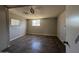 This room features a window, tile floor, a ceiling fan, and fresh, neutral paint at 4221 N 33Rd Dr, Phoenix, AZ 85017