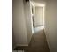 Interior hallway with tile flooring, neutral paint, and access to other rooms at 4221 N 33Rd Dr, Phoenix, AZ 85017