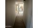 Hallway featuring tile flooring and doorways leading to other rooms in need of renovation at 4221 N 33Rd Dr, Phoenix, AZ 85017