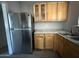 Kitchen featuring stainless steel refrigerator, cabinets and granite countertops at 4221 N 33Rd Dr, Phoenix, AZ 85017