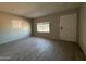 Bright and airy living room with tile floors, neutral paint color and a view of the front yard at 4221 N 33Rd Dr, Phoenix, AZ 85017