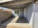 Covered patio area with a concrete floor, providing a shaded outdoor space, and access to the backyard at 4221 N 33Rd Dr, Phoenix, AZ 85017