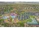 Aerial view showcasing the community's water park, clubhouse, and surrounding landscape at 42424 N Gavilan Peak Pkwy # 30104, Anthem, AZ 85086