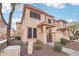 Inviting two-story townhouse with desert landscaping and a private front patio at 42424 N Gavilan Peak Pkwy # 30104, Anthem, AZ 85086