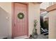 Inviting front door with a wreath, leading to a cozy entryway at 42424 N Gavilan Peak Pkwy # 30104, Anthem, AZ 85086