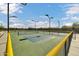 Outdoor pickleball court featuring a green surface, black fence and nets with clear blue skies at 42424 N Gavilan Peak Pkwy # 30104, Anthem, AZ 85086