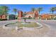 Community center featuring a large water fountain and landscaped entrance at 42808 W Whimsical Dr, Maricopa, AZ 85138