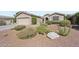 Single-story home with a well-maintained desert rock front yard, showcasing drought-tolerant landscaping at 42808 W Whimsical Dr, Maricopa, AZ 85138