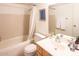 Cozy bathroom with a shower-tub combination, standard fixtures, and neutral-toned tiling at 4610 N 68Th St # 402, Scottsdale, AZ 85251