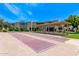 Community recreation area with shuffleboard courts, seating, and landscaped green spaces for residents at 4610 N 68Th St # 402, Scottsdale, AZ 85251