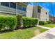 Exterior view of a multi-story condo building with well-kept lawns and manicured shrubbery at 4610 N 68Th St # 402, Scottsdale, AZ 85251