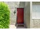 Condo front door with dark red finish, unit number 402, and a small welcome mat at 4610 N 68Th St # 402, Scottsdale, AZ 85251