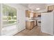 Efficient kitchen features white appliances and light wood cabinetry, providing ample space for cooking at 4610 N 68Th St # 402, Scottsdale, AZ 85251