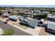 An aerial shot shows a well-maintained house with a gravel front yard and a spacious backyard ready for landscaping at 4749 W Beverly Ln, Glendale, AZ 85306