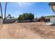 Spacious backyard with tall palm trees and potential for a dream outdoor oasis at 4749 W Beverly Ln, Glendale, AZ 85306