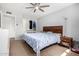 Bedroom featuring neutral carpet, a ceiling fan, and closet storage at 4749 W Beverly Ln, Glendale, AZ 85306