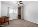 Cozy bedroom featuring neutral carpet, a ceiling fan, and built-in closet at 4749 W Beverly Ln, Glendale, AZ 85306