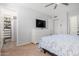 Bedroom featuring a walk-in closet, carpeting, and light paint at 4749 W Beverly Ln, Glendale, AZ 85306