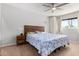 Cozy bedroom with a ceiling fan and a window letting in natural light at 4749 W Beverly Ln, Glendale, AZ 85306