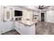 Bright kitchen with granite counters, an island with seating, and a door to the outside at 4749 W Beverly Ln, Glendale, AZ 85306