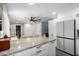 Spacious kitchen with granite counters, an island with bar seating, and stainless steel appliances at 4749 W Beverly Ln, Glendale, AZ 85306