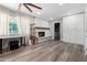 Spacious living room features hardwood floors, a fireplace, large window and built-in storage at 4749 W Beverly Ln, Glendale, AZ 85306